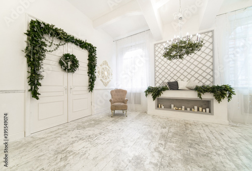 White studio with christmas wreath on the door
