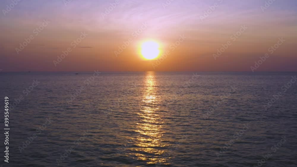 4K Phuket Thailand beautiful tropical beach with sunset sky. Beautiful Phuket beach is famous tourist destination at Andaman sea summer concept. Areal drone view moving over the sea with sunset 4K Phuket Thailand beautiful tropical beach with sunset sky. Beautiful Phuket beach is famous tourist destination at Andaman sea summer concept. Areal drone view moving over the sea with sunset