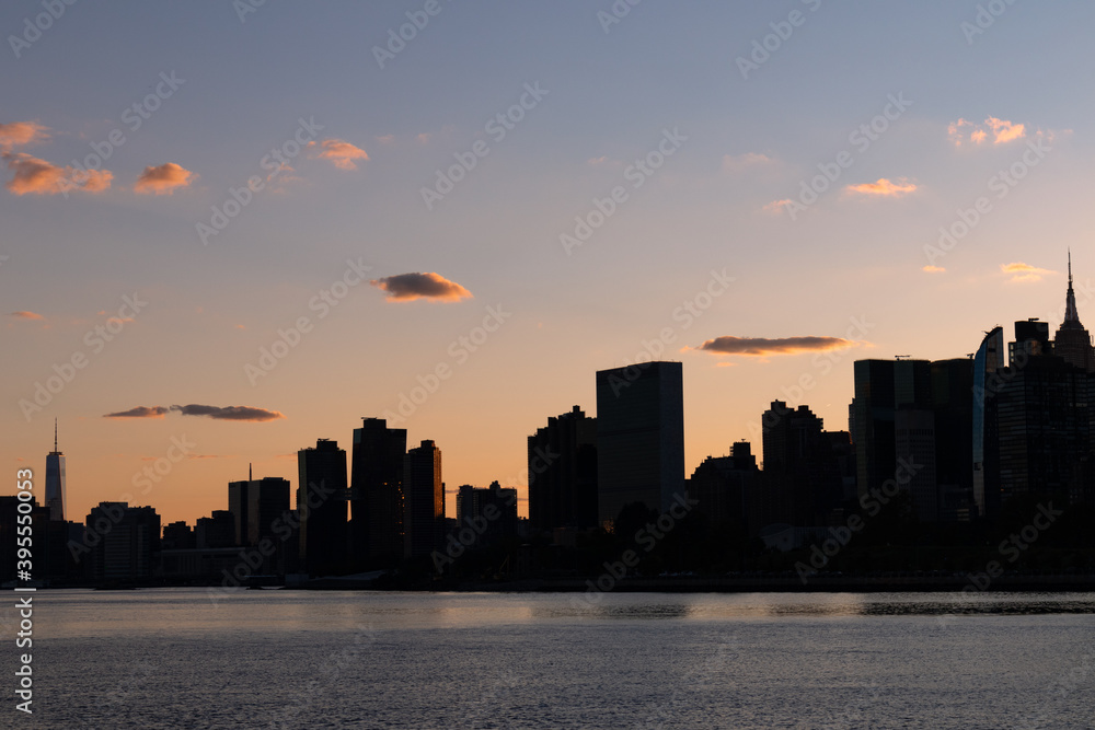 Silhouette of the Manhattan Skyline along the East River during a Beautiful Sunset in New York City