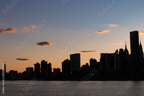 Silhouette of the Manhattan Skyline along the East River during a Beautiful Sunset in New York City © James