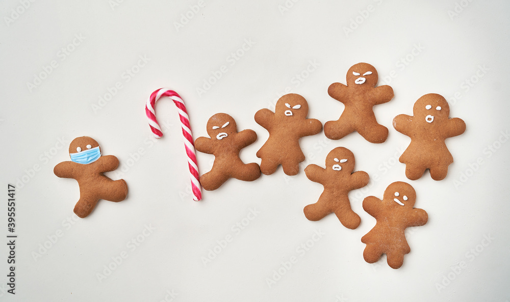 Funny gingerbread man shaped cookies with facial masks