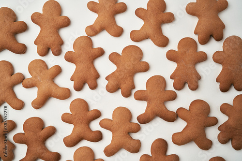 Top view of gingerbread man cookies on white background