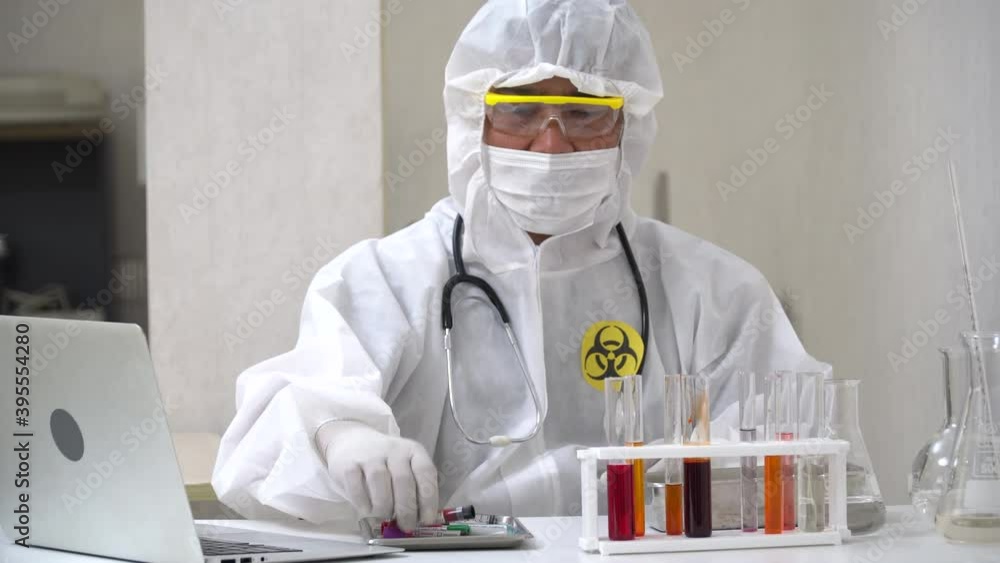 asian doctor wearing ppe suit . testing and experimental vaccine for coronavirus or covid 19 asian doctor wearing ppe suit . testing and experimental vaccine for coronavirus or covid 19