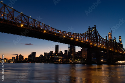 The Queensboro Bridge during the Evening with the Manhattan Skyline along the East River in New York City
