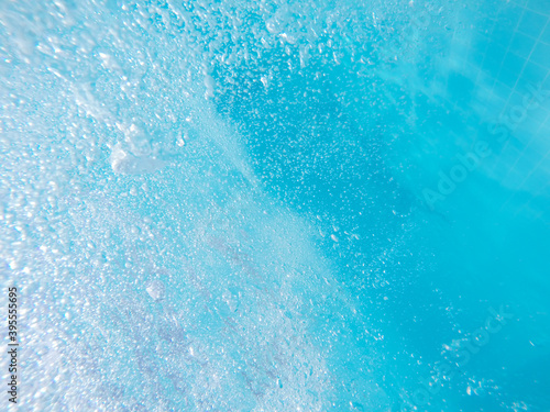 Blue transparent water with many bubbles background