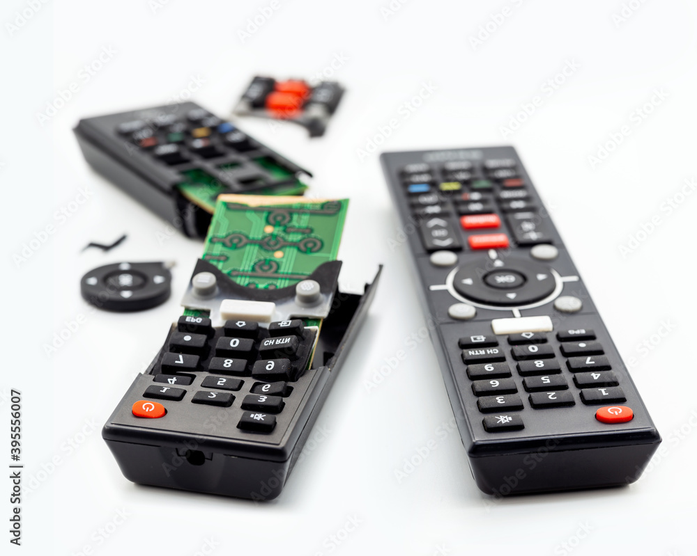 remote control for smart TV, a new control and a broken one. Concept of technological waste, fragile technology, before and after remote control for smart TV, a new control and a broken one. Concept of technological waste, fragile technology, before and after