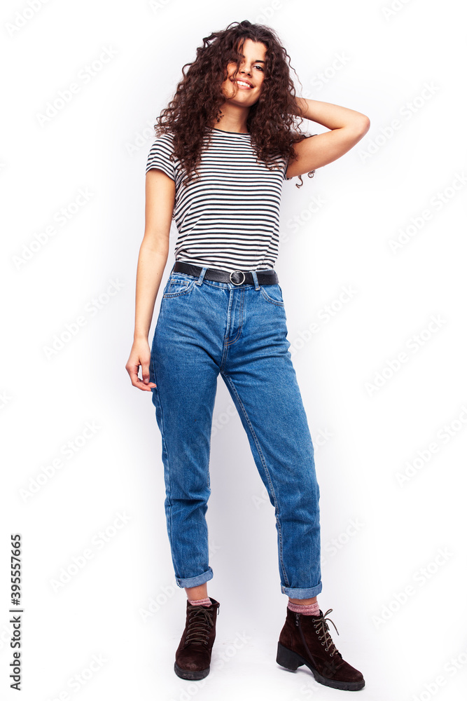 young pretty woman with curly brunette hair posing cheerful on white background isolated, lifestyle people concept