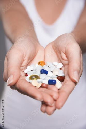 Closeup Of Hands With Colorful Pills