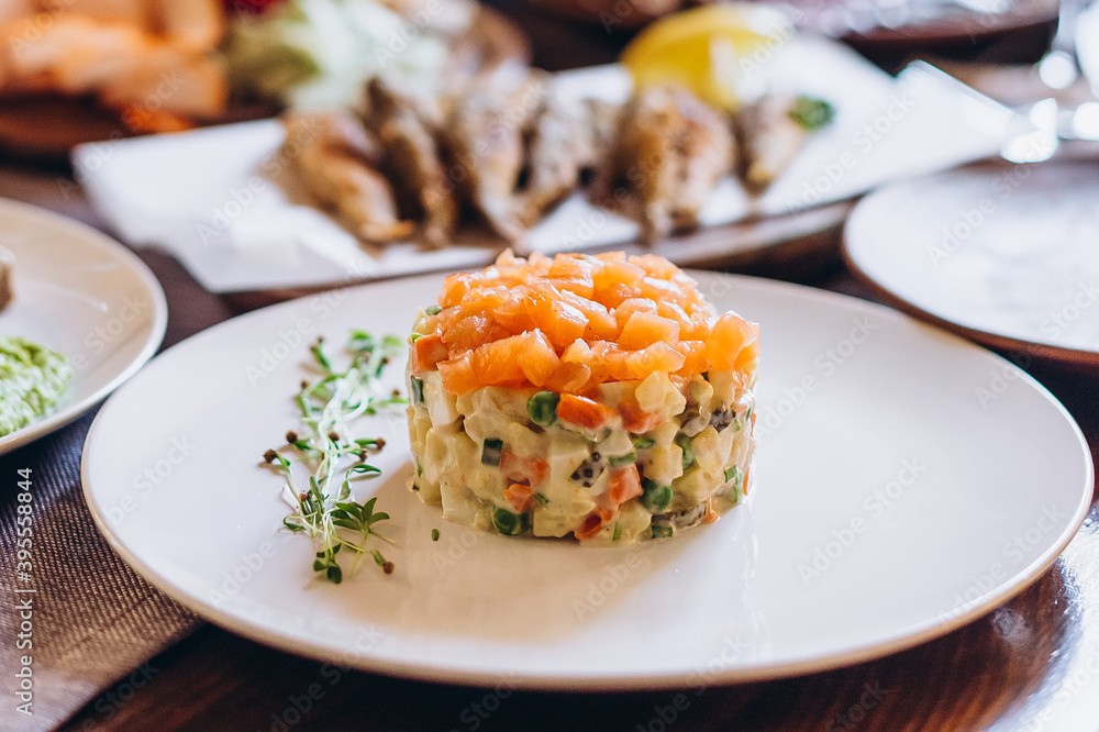 The restaurant table with Ukrainian and European cuisine is served with various delicious dishes for the reception The restaurant table with Ukrainian and European cuisine is served with various delicious dishes for the reception
