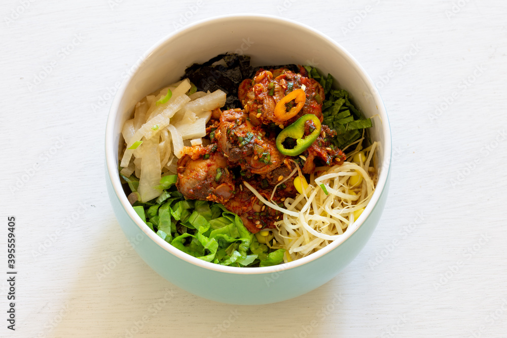 Korean food, Kkomag Bibimbab which is mixed with rice, vegetables and blood cockle Korean food, Kkomag Bibimbab which is mixed with rice, vegetables and blood cockle