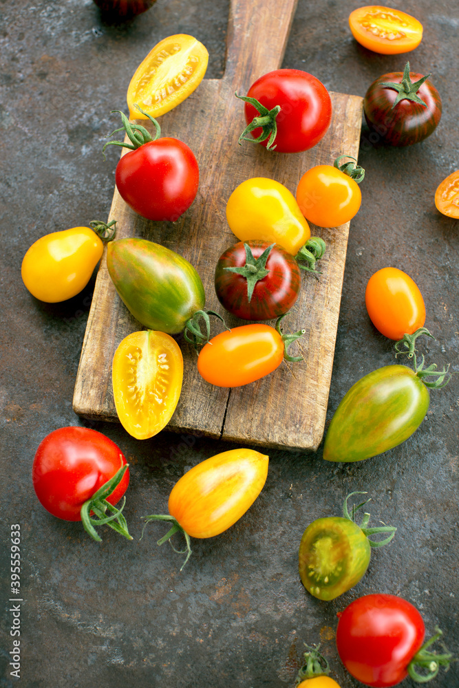 Colourful tomatoes on a rustic surface