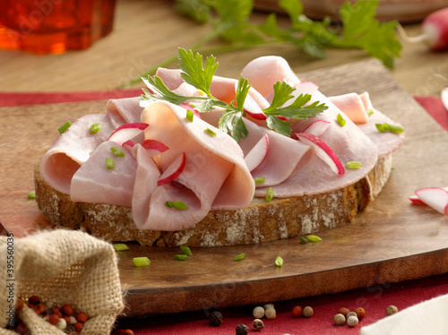Hearty country bread with cooked ham and parsley photo