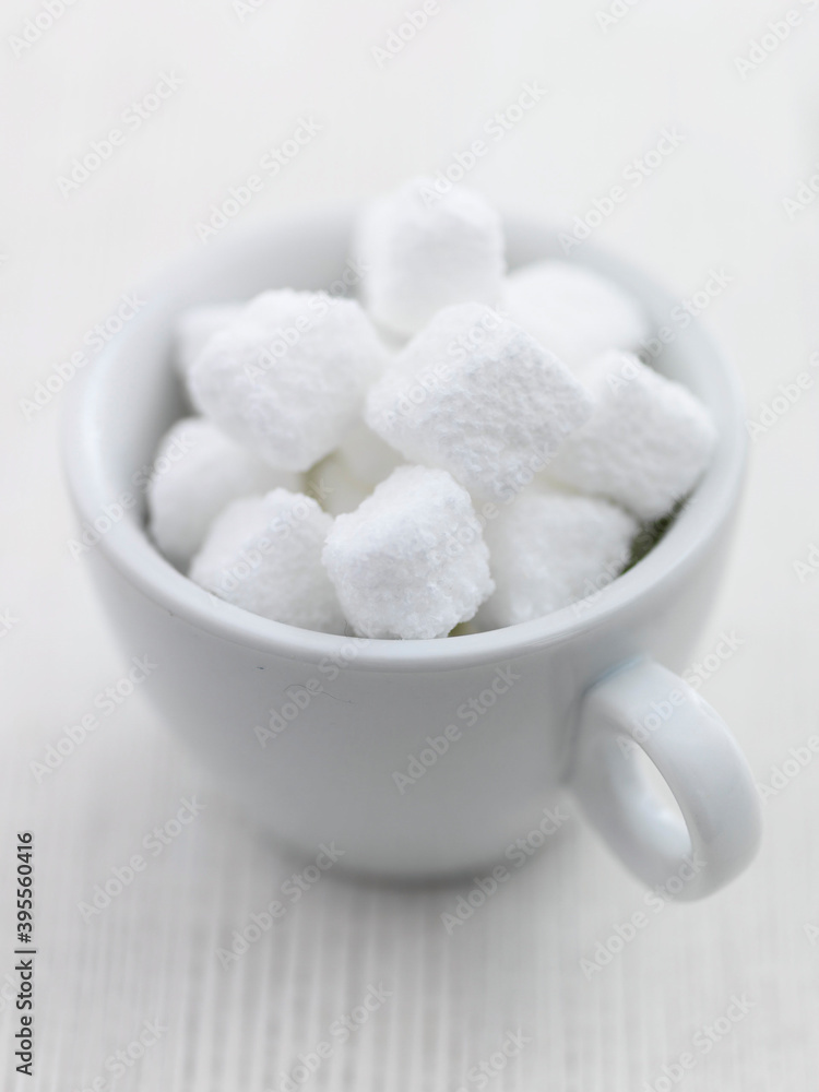 Cup of white sugar lumps Cup of white sugar lumps