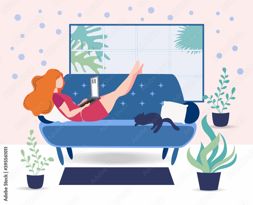 Obraz premium A woman works on a laptop at home on the couch. Freelance concept, quarantine due to covid-19