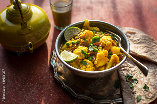 Indian cauliflower tumeric curry with chapati photo