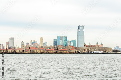 Ellis Island Immigrant Station and Jersey City Skyline in Background. New York City  USA