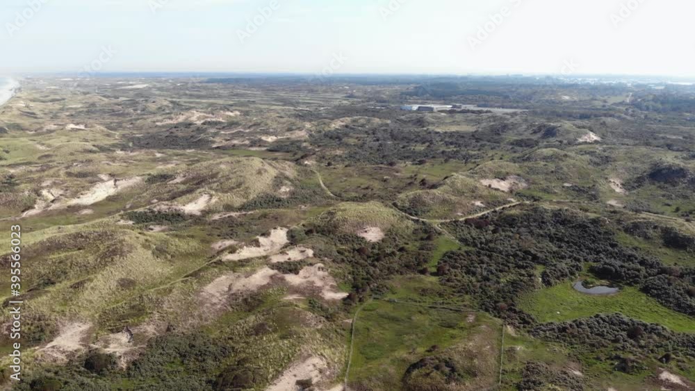 Coastal lowlands with small barren hills in Wijk aan Zee, North Holland, the Netherlands - Fly-Over Aerial shot Coastal lowlands with small barren hills in Wijk aan Zee, North Holland, the Netherlands - Fly-Over Aerial shot