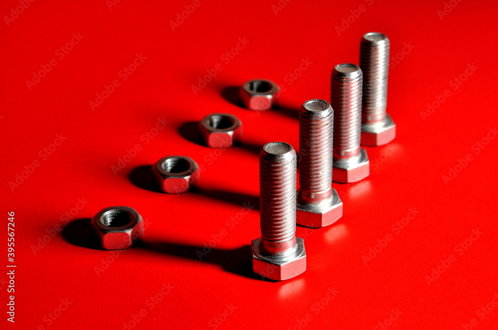 Metal bolts and nuts with shadowsinteract. Metal bolts and nuts with shadowsinteract.