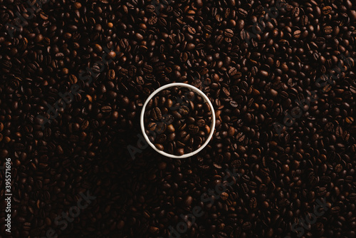 aromatic coffee cup background on coffee beans