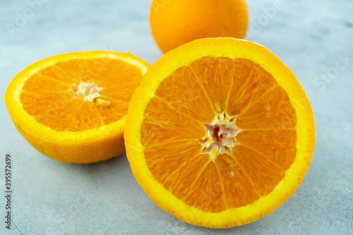 Closeup of sliced fresh orange fruit on a concrete surface photo