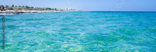 Calm sea  blue water  sky and horizon scene in Tunisia. Vacation relaxing concept. Web banner for your design.
