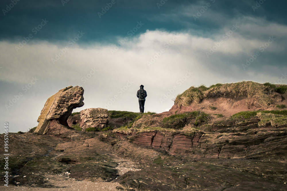 a man staring into the distance from the Hilbre Islands.