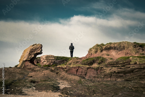 a man staring into the distance from the Hilbre Islands.