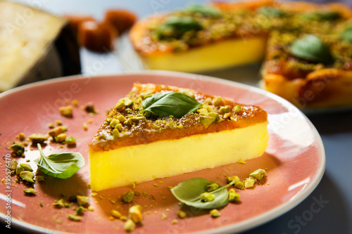Cheesecake with quince jelly and pistachios photo