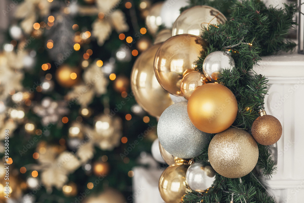 Gold and silver Christmas toys, balls garlands on a spruce branch Gold and silver Christmas toys, balls garlands on a spruce branch