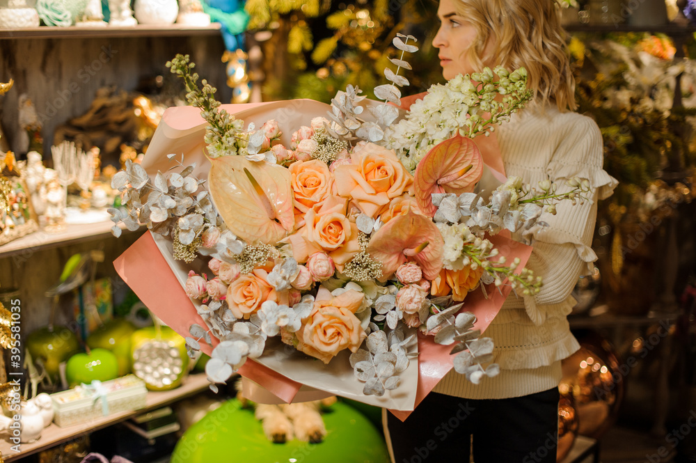luxury floral bouquet of calla lilies and orange roses and eucalyptus wrapped in paper luxury floral bouquet of calla lilies and orange roses and eucalyptus wrapped in paper
