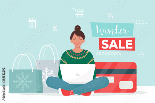Woman buys goods in online store from home. Winter sale banner . Vector illustration in flat style