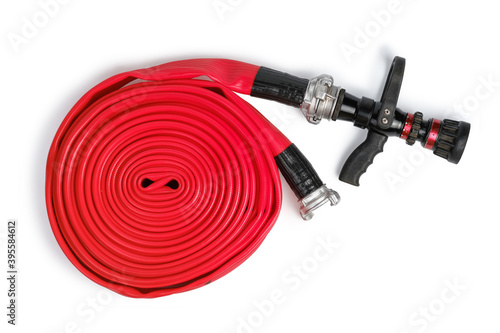 Red rolled firefighter hose isolated on the white background. Flat Lay, top view photo