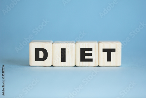 diet . concept. Word written with wooden cubes. Education, business, medical , quality control. Blue background
