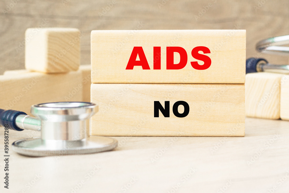 the words AIDS NO are written on a wooden cubes structure . Cube on a bright background. Can be used for Medical concept. the medicine. the words AIDS NO are written on a wooden cubes structure . Cube on a bright background. Can be used for Medical concept. the medicine.