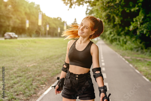 Teenage girl in sportswear roller skating