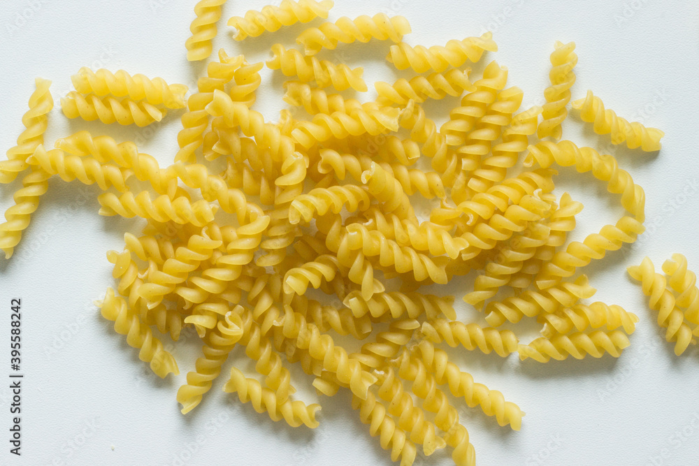 Close up of uncooked fusilli noodles; italian pasta Close up of uncooked fusilli noodles; italian pasta