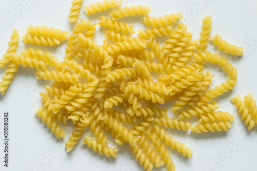 Close up of uncooked fusilli noodles; italian pasta