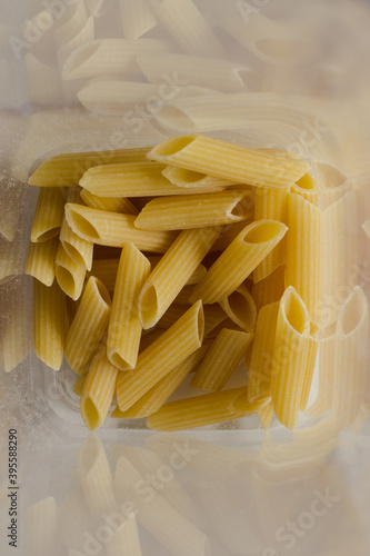 Close up of penne noodles; full frame; uncooked italian pasta