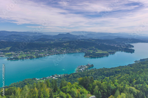 Aerial view with the alpine lake Worthersee from The Pyramidenkogel  the highest wooden viewing tower in the world  famous tourists attraction in Carinthia region  Austria