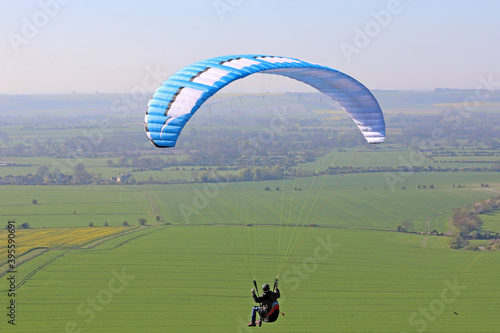 Paraglider flying at Milk Hill, Wiltshire 