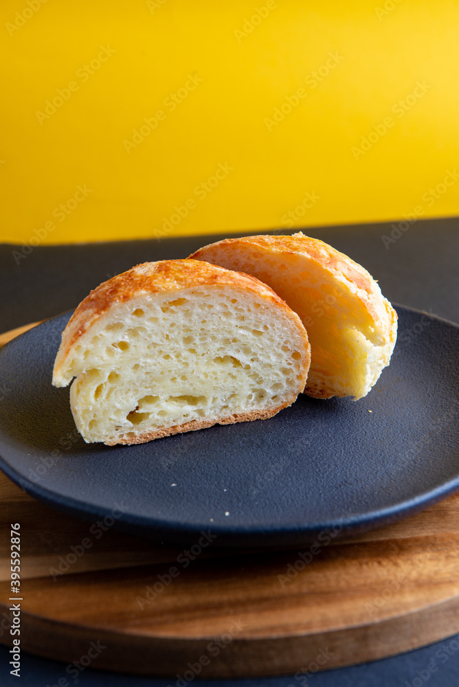 pão de queijo with yellow background