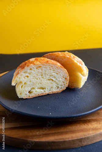 pão de queijo with yellow background