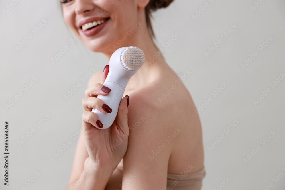 Studio beauty portrait of a young, healthy, beautiful, fresh skinned caucasian woman on a grey background Studio beauty portrait of a young, healthy, beautiful, fresh skinned caucasian woman on a grey background