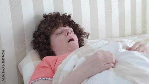 woman sleeping in bed and snoring