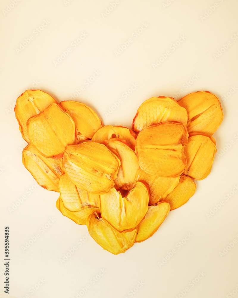 Fresh organic fruit and dried fruit slices on a white wooden background. Copy space