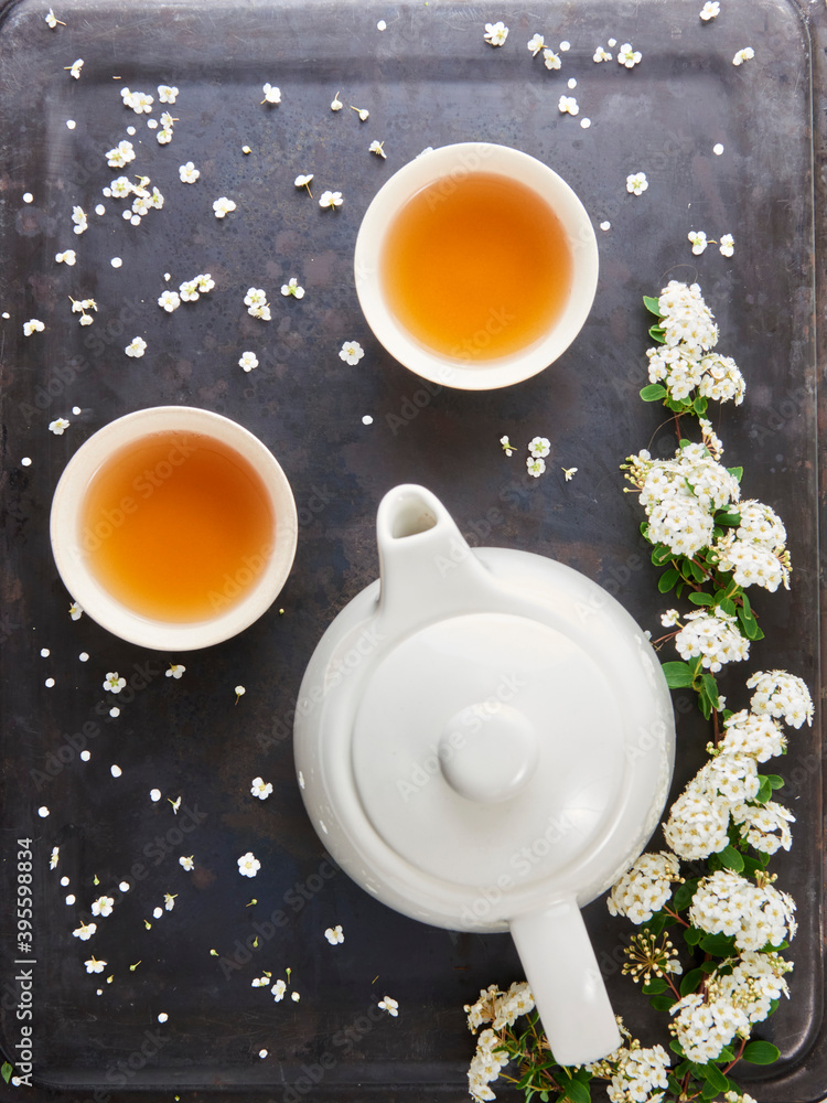 Tea bowls, teapot and white flowers Tea bowls, teapot and white flowers