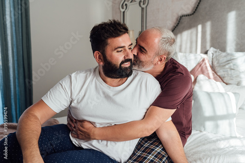 Two sexy men. Love and relationships at home. Sex and passion. Tenderness and beauty. Two men love each other.