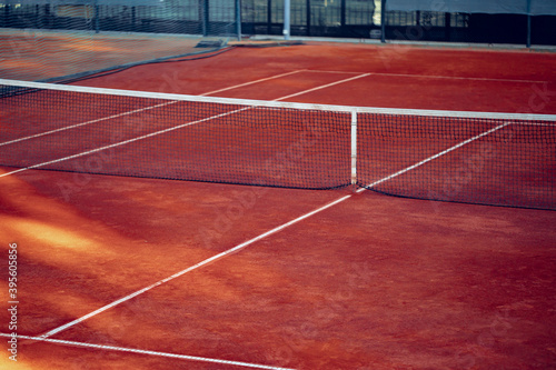 Empty lined clay tennis field and net © fotofabrika