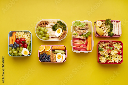 School lunchboxes with various healthy nutritious meals