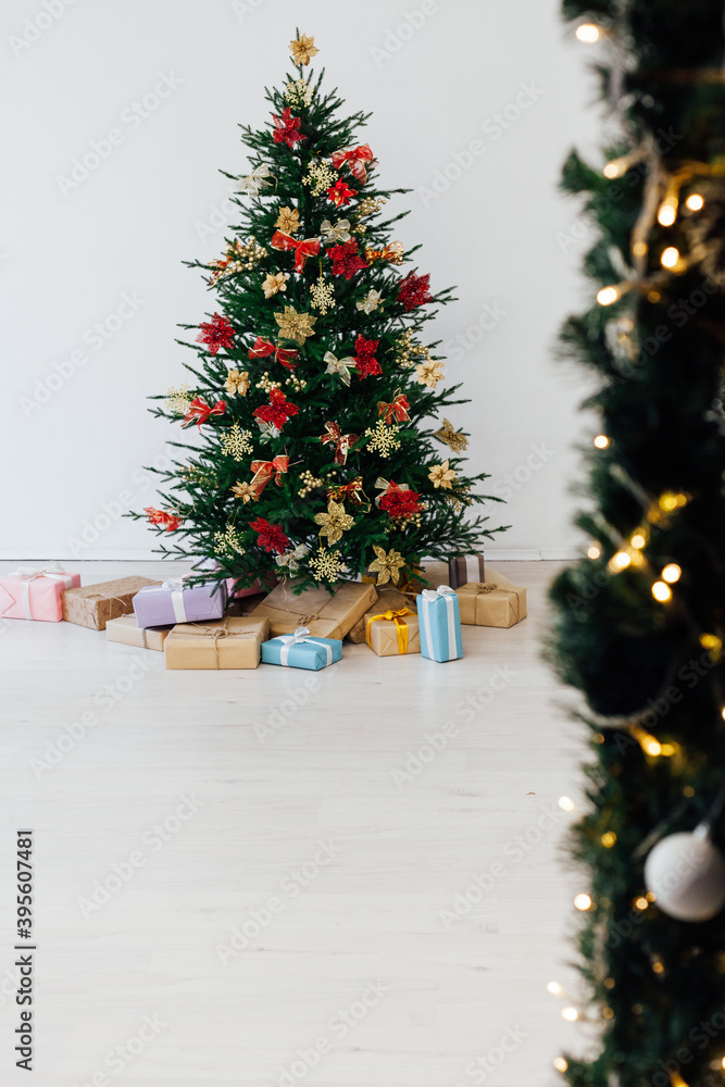 decorated room with Christmas tree with presents under it